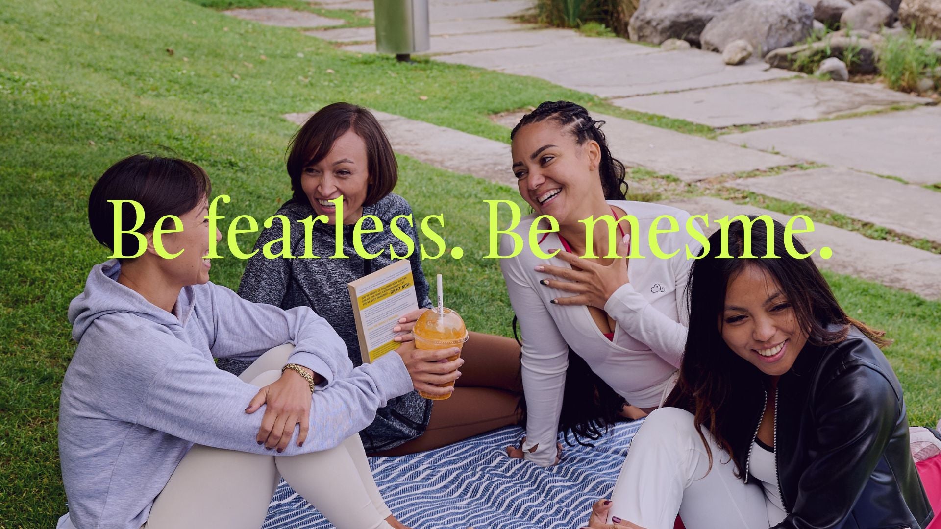 Four people sitting on a blanket outdoors with a mesme motivational quote overlay.