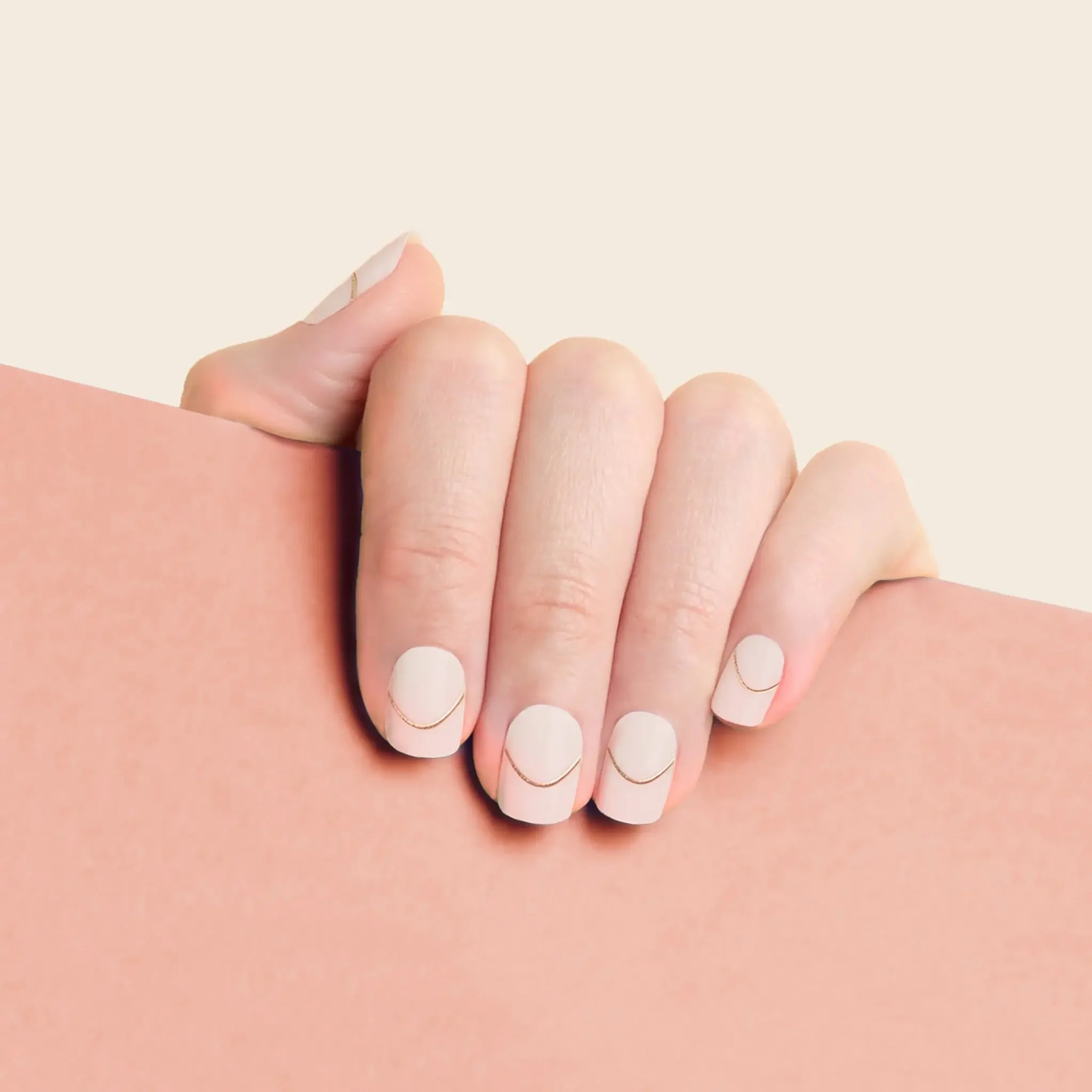 mesme Charlotte Nude Gold 3+ Day UV-Free Gel Nail Wraps On Hand