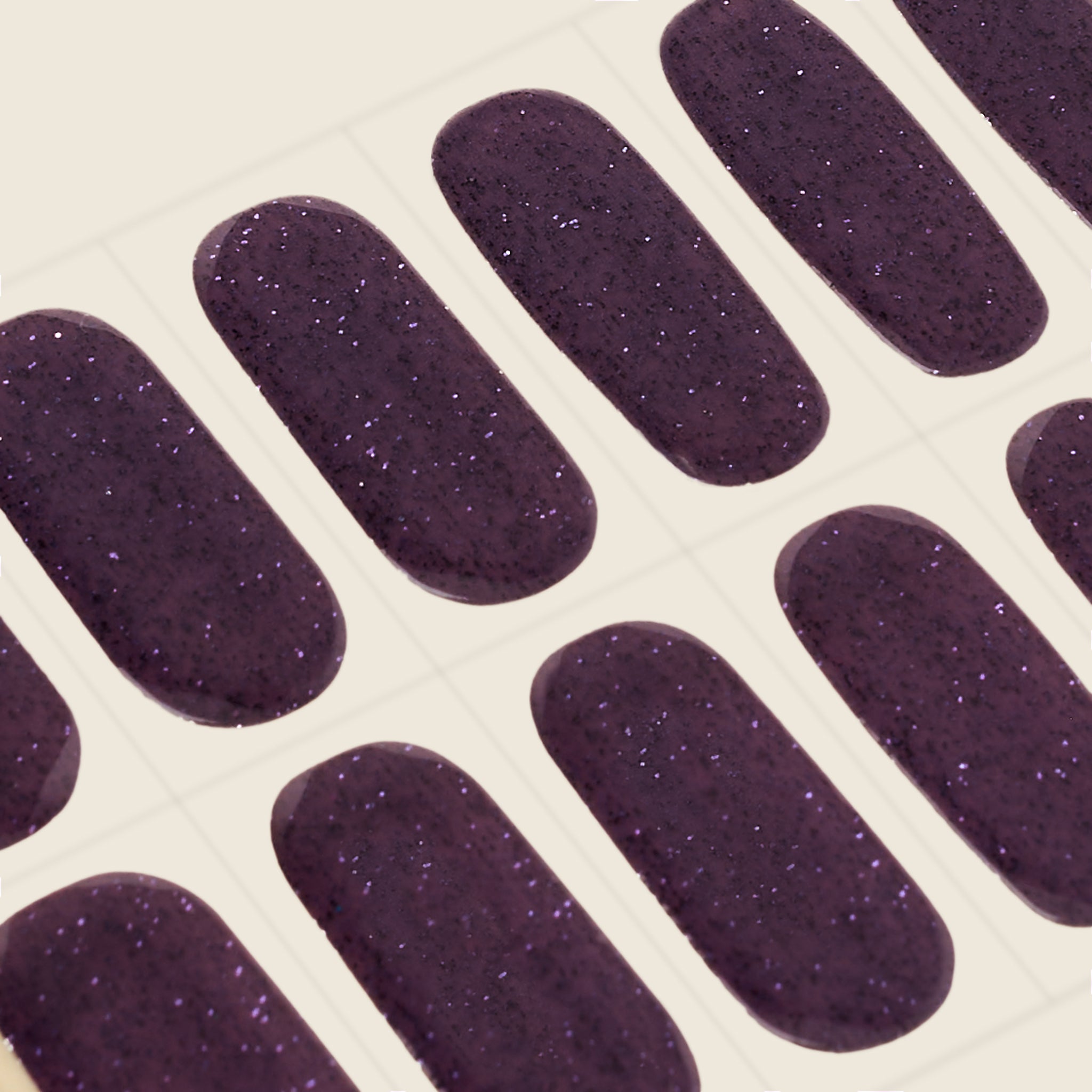 mesme Stephanie Dark Plum Glitter 10-Day UV-Free Nail Wraps — Strip Sheet Close-Up